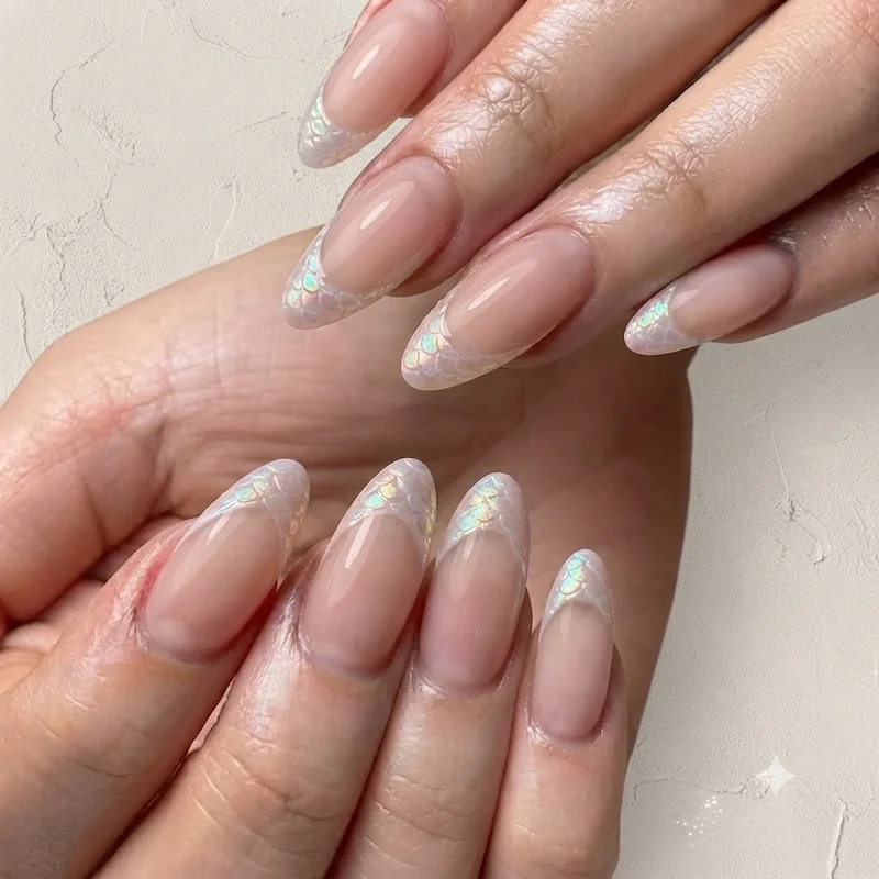 Soft minimal dragon nail design with pastel base and subtle iridescent scale accent