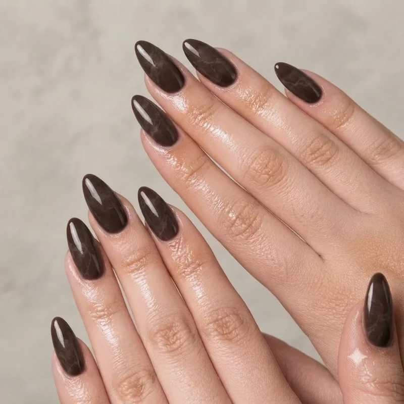 Deep espresso brown manicure with stone texture nuance marbling effect nail inspo