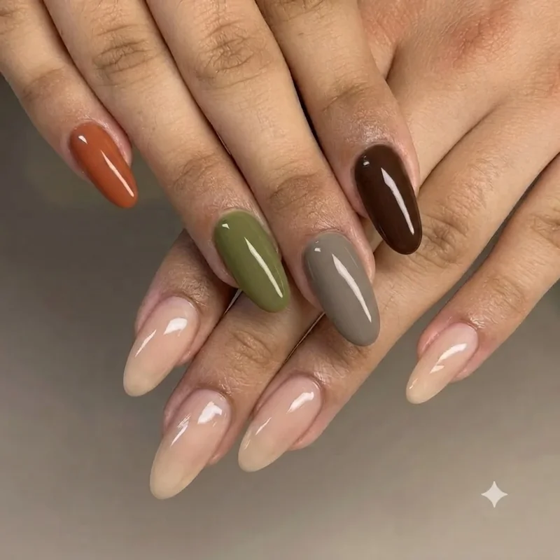 Four earthy nail shades terracotta olive mushroom espresso compared side by side on hand