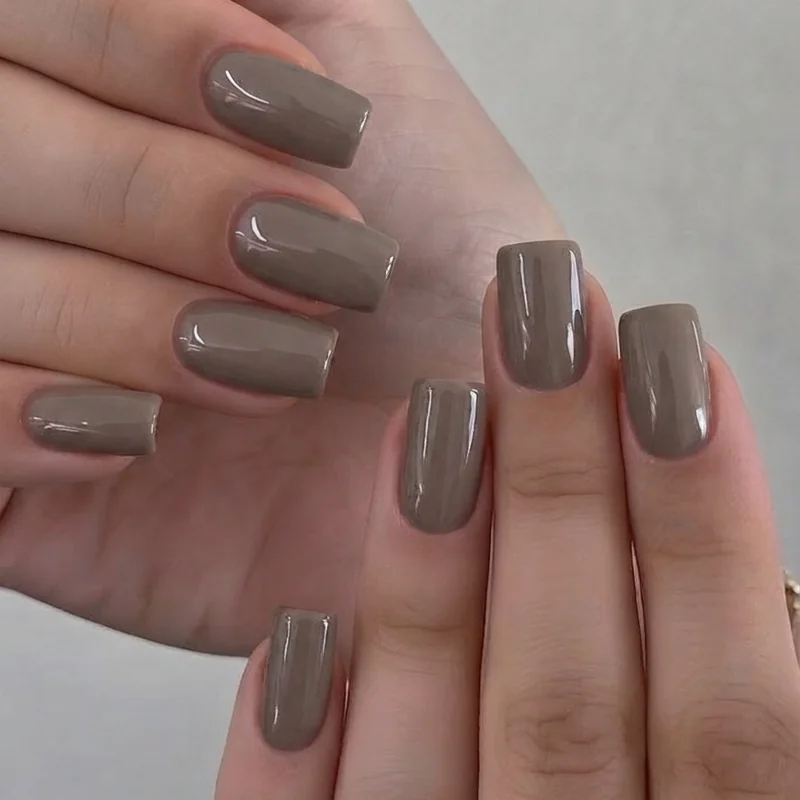 Mushroom toned minimal manicure glossy finish short square shape earthy nail inspo