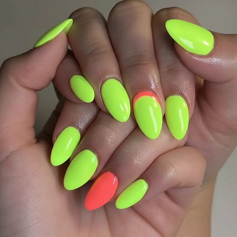 Neon lime and electric coral gel nails photographed under UV blacklight showing intense glow effect at rave festival EDC Las Vegas