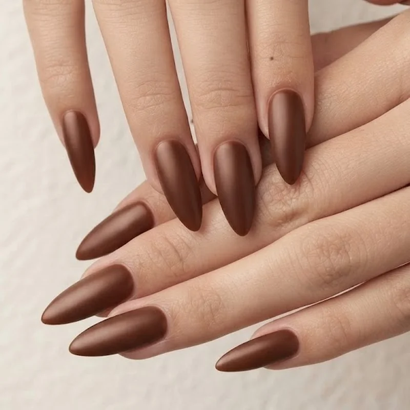Almond-shaped brown nails for fall with an elongated tapered tip design