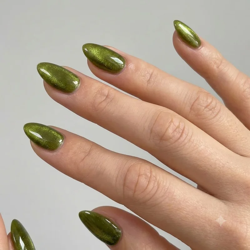 Deep wine burgundy glossy manicure fall 2026 on almond shaped nails with high shine finish