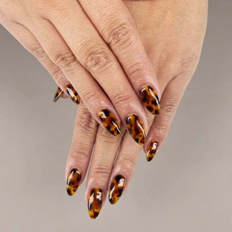 Classic tortoiseshell nails fall amber brown black layered pattern on medium length nails