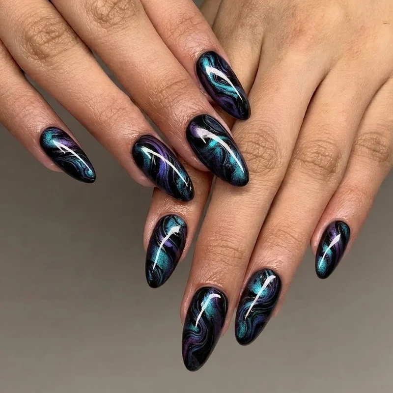Oil-slick marble psychedelic rave nail design swirling black purple and teal