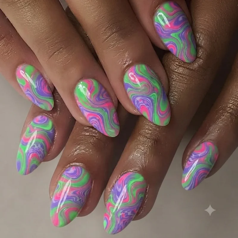 Wide shot of neon and trippy rave nail set on almond shape establishing raver identity