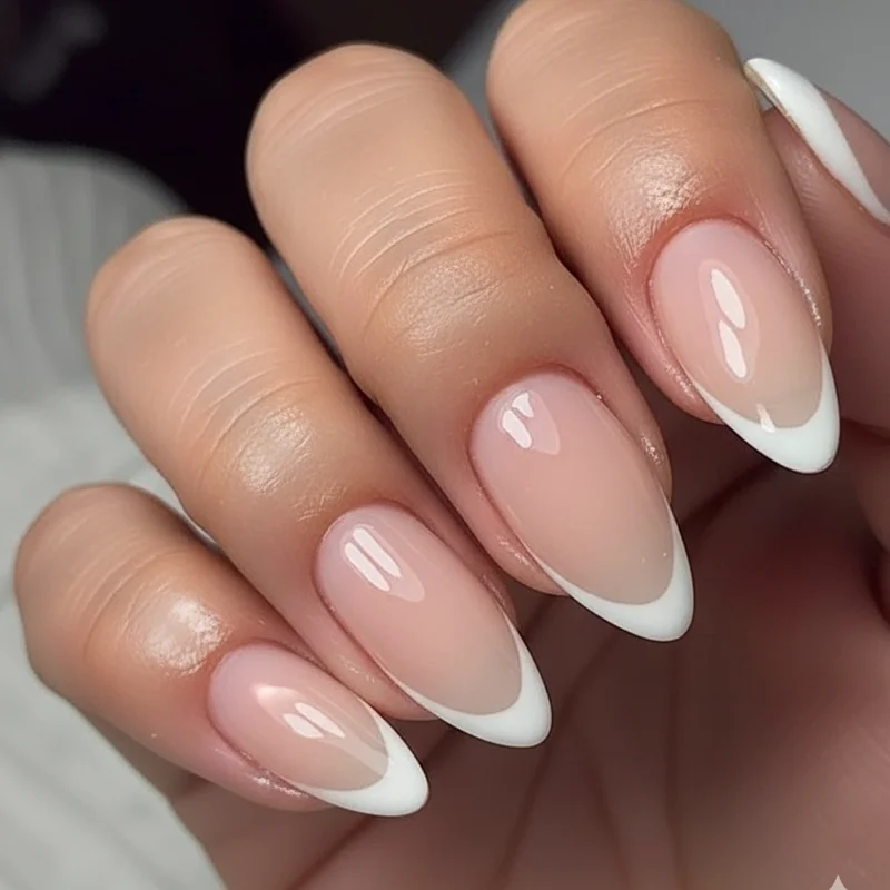 Micro french tip almond nails showing ultra thin whisper line on milky sheer base with grow out comparison at two and four weeks