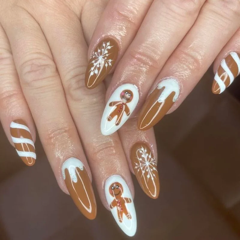 Gingerbread cookie Christmas nails brown white icing candy cane stripes festive holiday nail art designs cozy winter