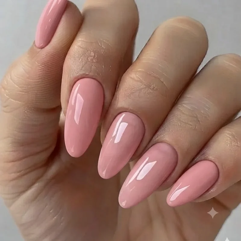 At-home friendly barbie nails in a simple glossy pink finish, an approachable DIY barbiecore manicure