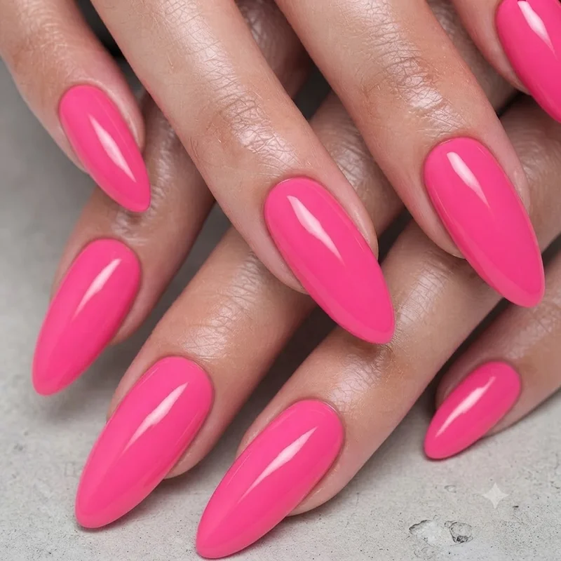 Barbie nails in a confident solid hot pink almond manicure, a full-saturation identity-driven look
