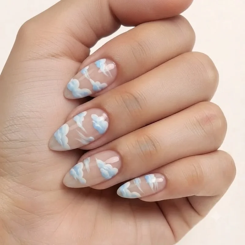 Cinnamoroll press-on nail set styled with cloud designs in pastel blue and white, ready to apply at home