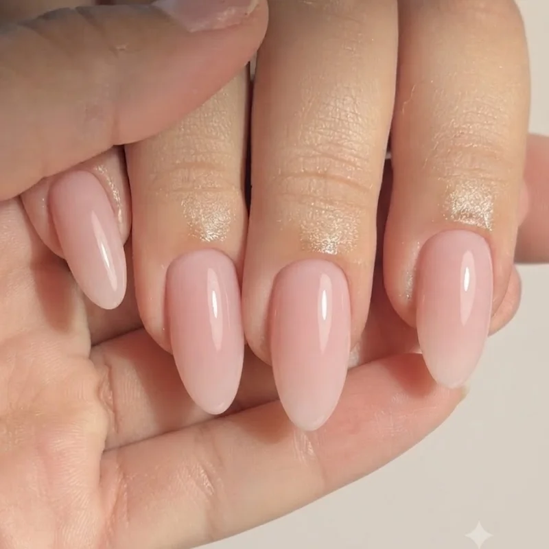 Almond shaped girly nails manicure in soft pink with glossy finish