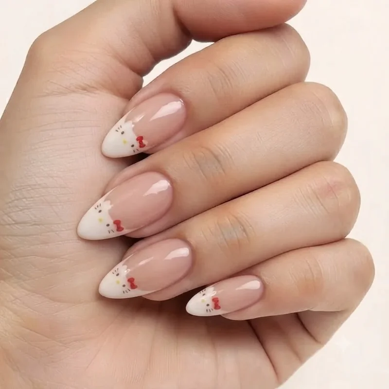 Almond shaped nails with Hello Kitty French tip design showing the natural taper