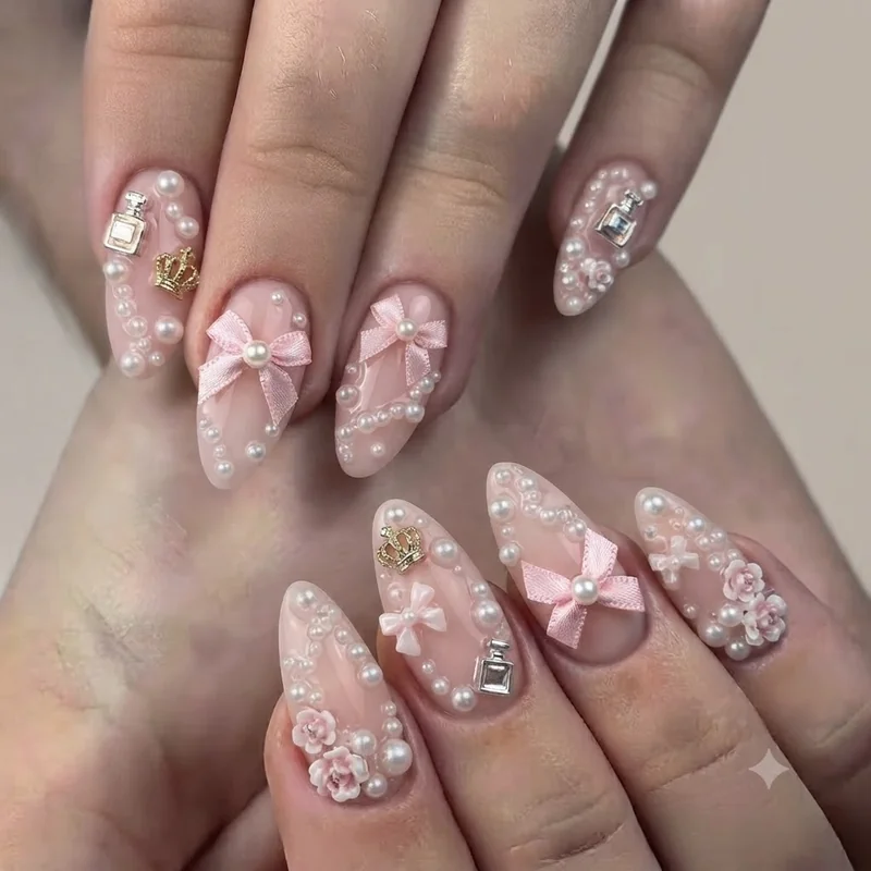 My melody nails 3D charm design with satin bows, pearls and figural embellishments on pink base