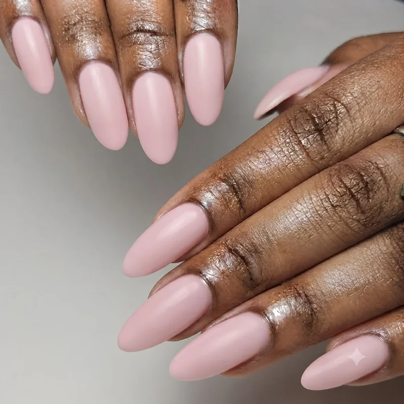 Short almond my melody nails set in pastel pink proving the look works on shorter nail lengths