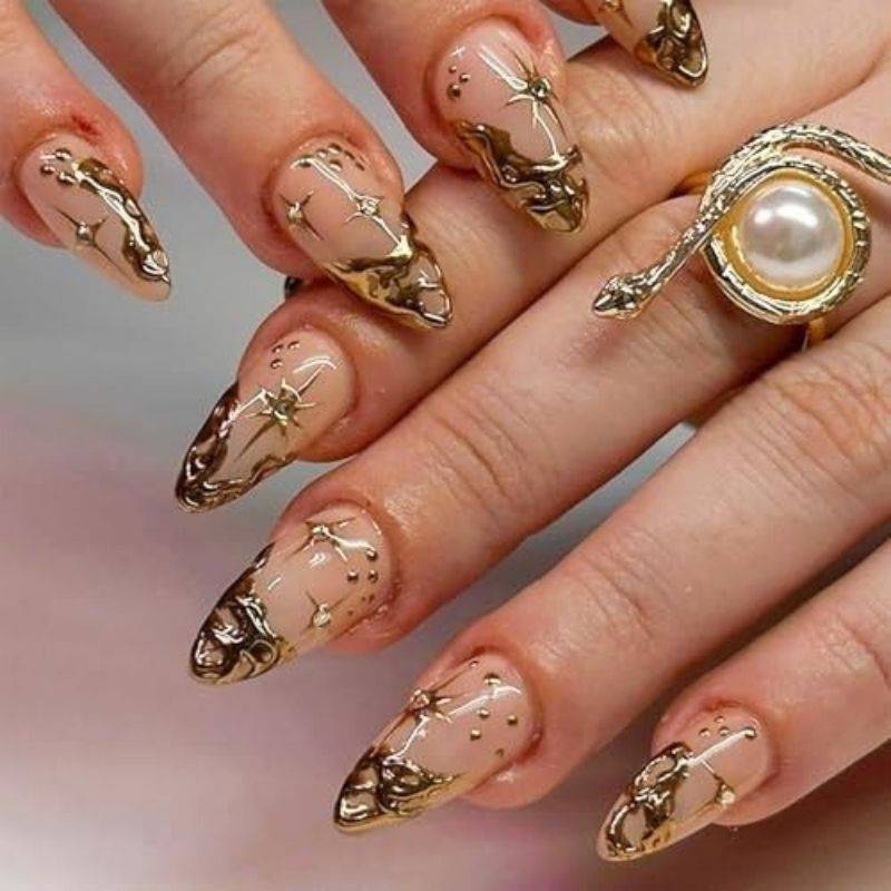 Gold goddess nails with metallic foil accents