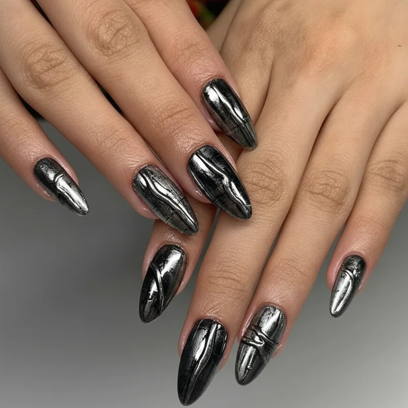 Chrome industrial nails with liquid metal mirror silver finish on black coffin shape gunmetal goth manicure 2026