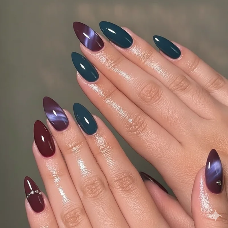 Trending goth nail colors 2026 featuring smoky amethyst dark teal oxblood deep cherry and cat eye gel magnetic finish dark nails