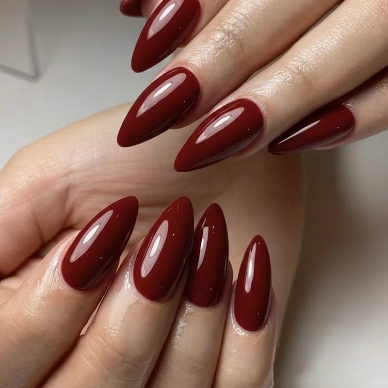 Vampy nails on short nails showing almond coffin and round shapes in oxblood blood red and dark plum for natural nail length