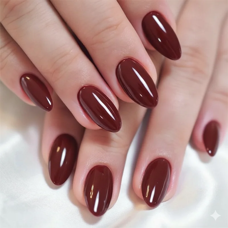Wearable vampy nails in deep wine red and oxblood showing year-round professional and office appropriate dark nail designs