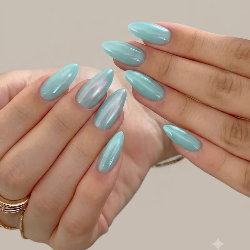 Tiffany Blue glazed jelly manicure with sheer turquoise base and soft chrome veil in almond nail shape