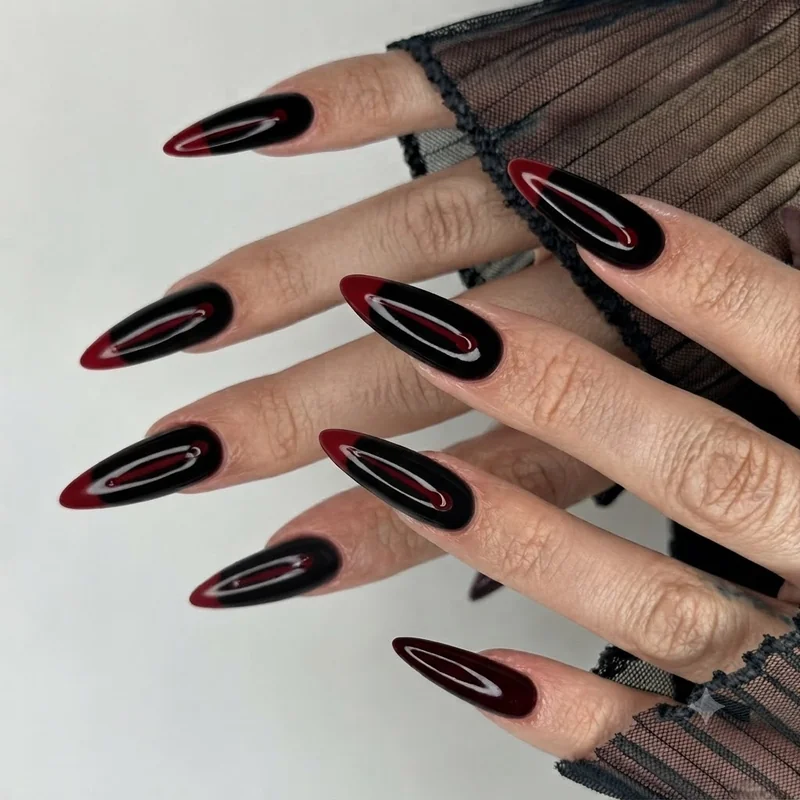 Blood-drip French tips on black almond nails, a single drip line per nail that suits vampire and slasher costumes this fall