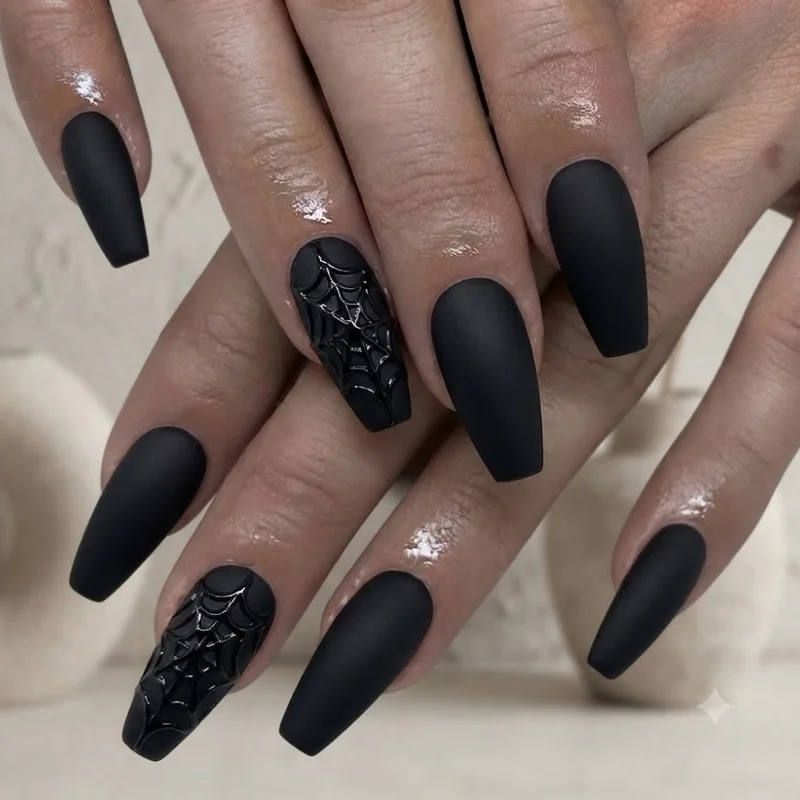 Matte black halloween nails in coffin shape with raised 3D spider web texture detail
