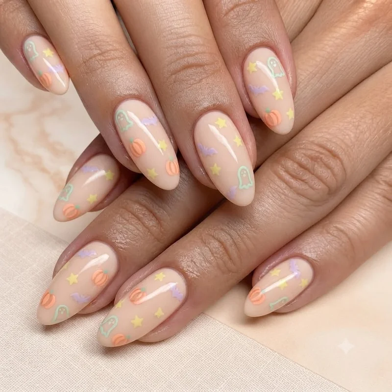 Pink and lavender pastel Halloween nail colour palette swatches on hand