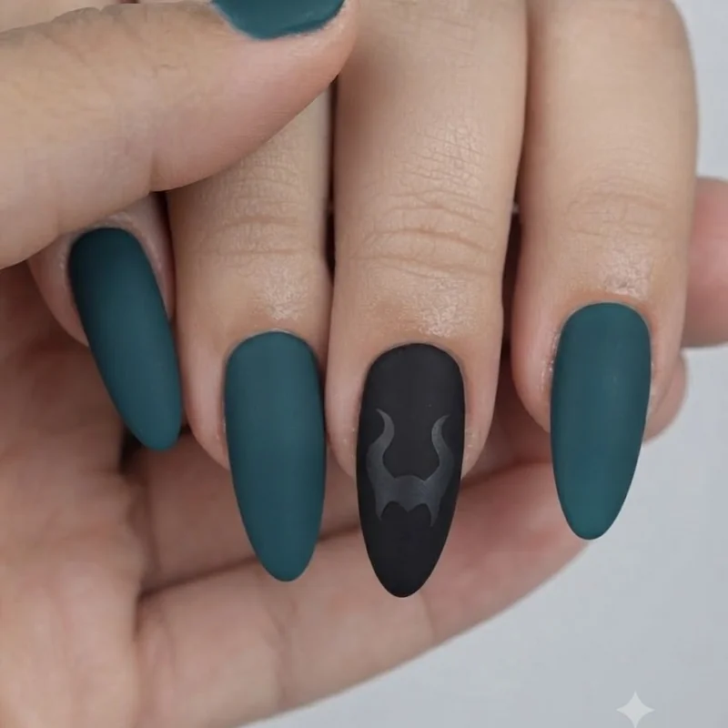 Maleficent inspired disney villain nails in deep teal and matte black with horn silhouette accent nail detail