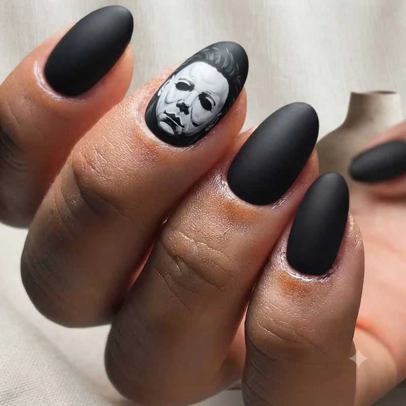Michael Myers mask hand-painted in flat white and black on a matte almond-shaped accent nail