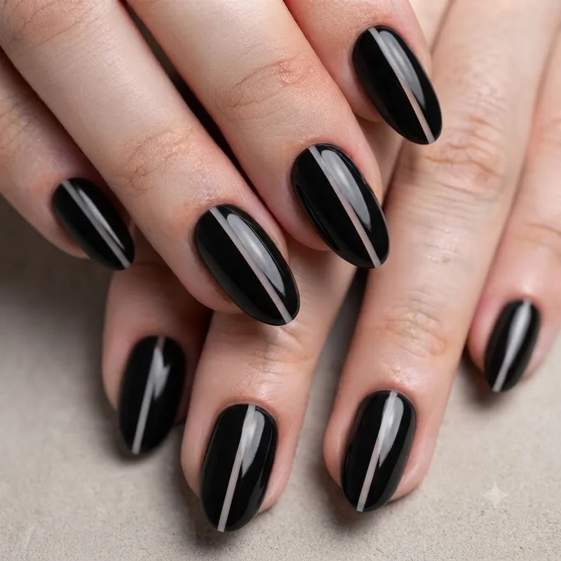 Short almond Halloween nails with negative space design demonstrating elongation technique