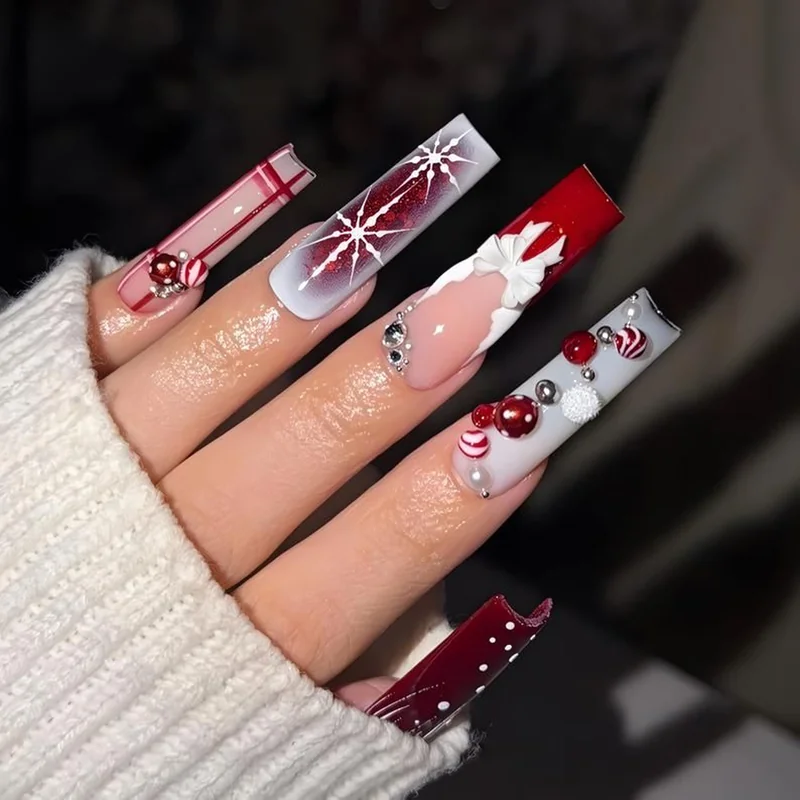 Hand painted candy cane nail art showing detailed brush technique for custom stripes