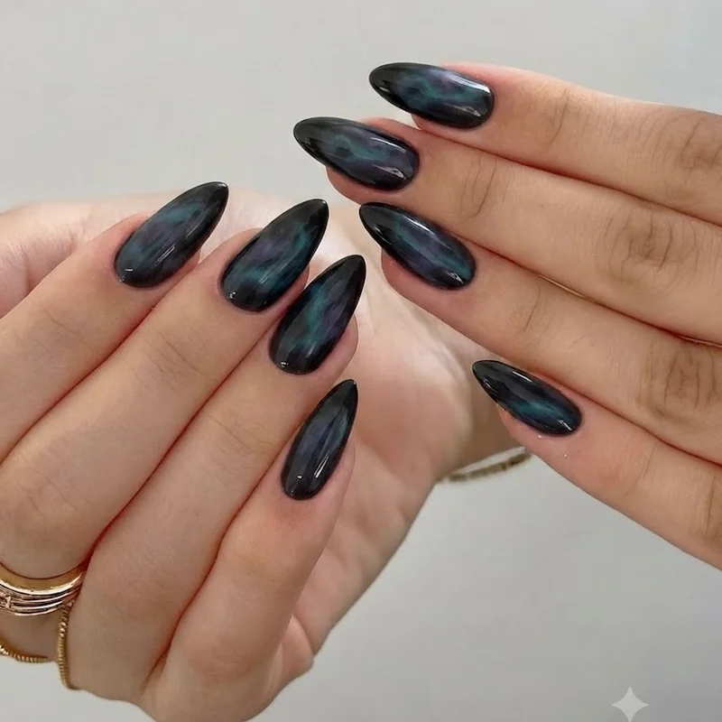 Dark aurora inspired mountain nails with charcoal base and teal violet night sky wisps