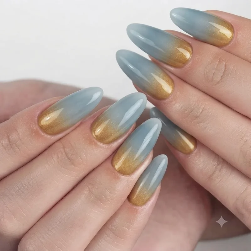 Yellowstone national park nails in warm geyser gold ombre fading into steamy mineral blue