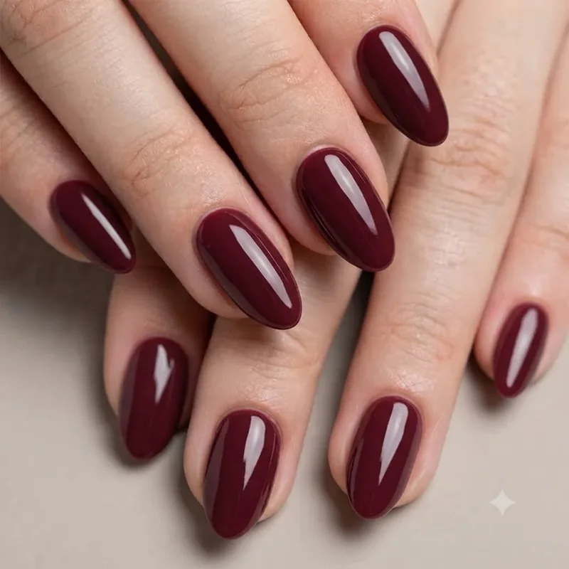 90s nail trends black cherry polish manicure with glossy nostalgic finish
