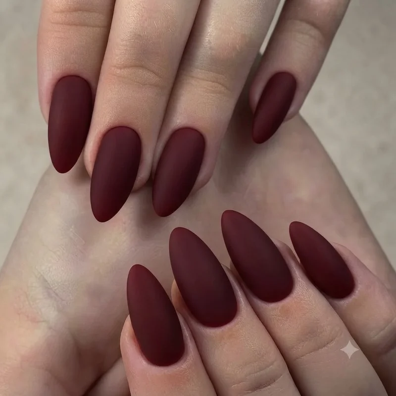 90s nail trends grunge manicure in dark cherry polish with matte finish