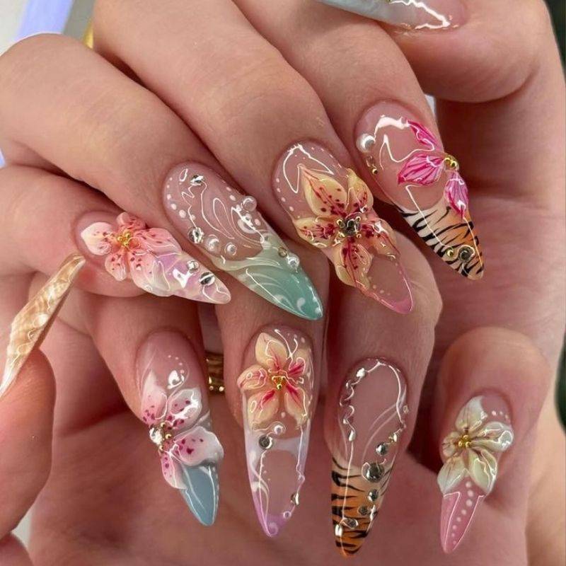 Tropical vacation nails with palm trees and ocean blue colors for beach getaways