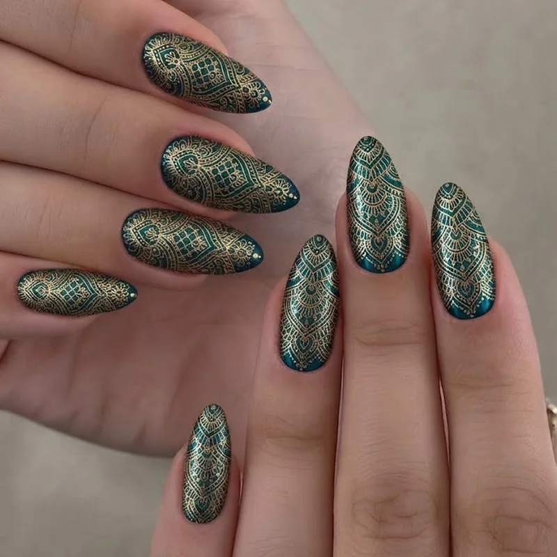 Culture inspired intricate nail art with mehndi Mughal pattern gold linework on jewel toned base
