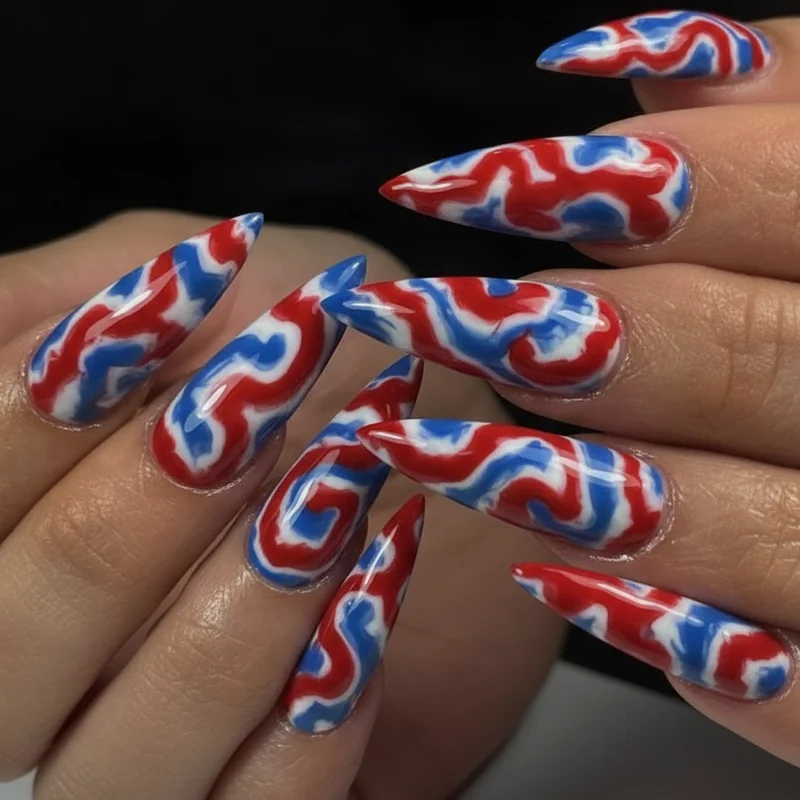 Bold fourth of july nails with red white and blue tie dye marble swirl design