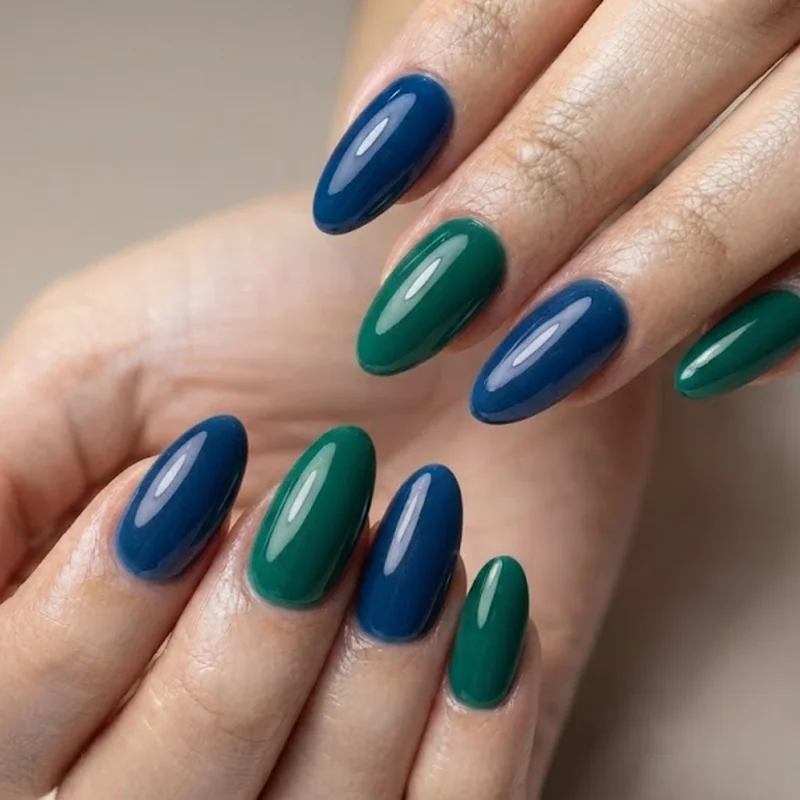 Jewel tone emerald sapphire glossy manicure rich saturated color nail finish
