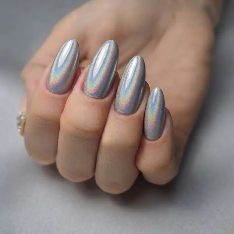 Chrome and holographic concert nails with a mirror finish polish inspired by Kesha's futuristic disco stage era tour looks