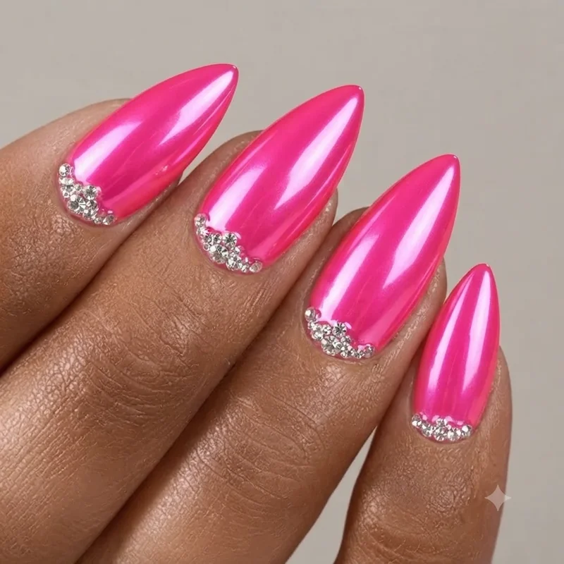 Neon pink chrome stiletto nails with rhinestone accents inspired by Kylie Jenner Birthday Look