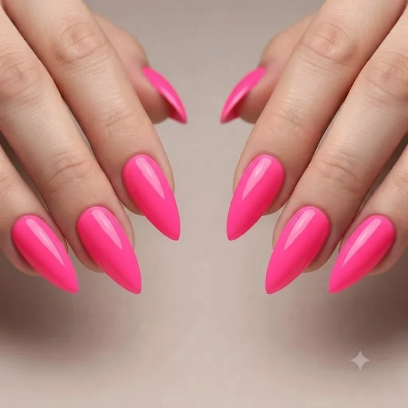 Close up of long stiletto nail shape with sharp tapered tip in bold colour finish