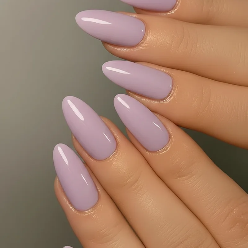 Best lavender nail polish summer 2026 showing OPI Polly Want a Lacquer and Essie Jelly Gloss bottles alongside nail swatches on pale and medium skin