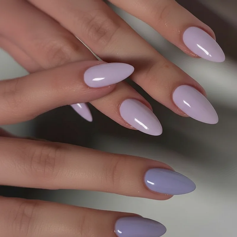 Four lavender nail shade swatches comparing cool blue lavender, warm pink lilac, bright periwinkle, and muted smoky grey lavender