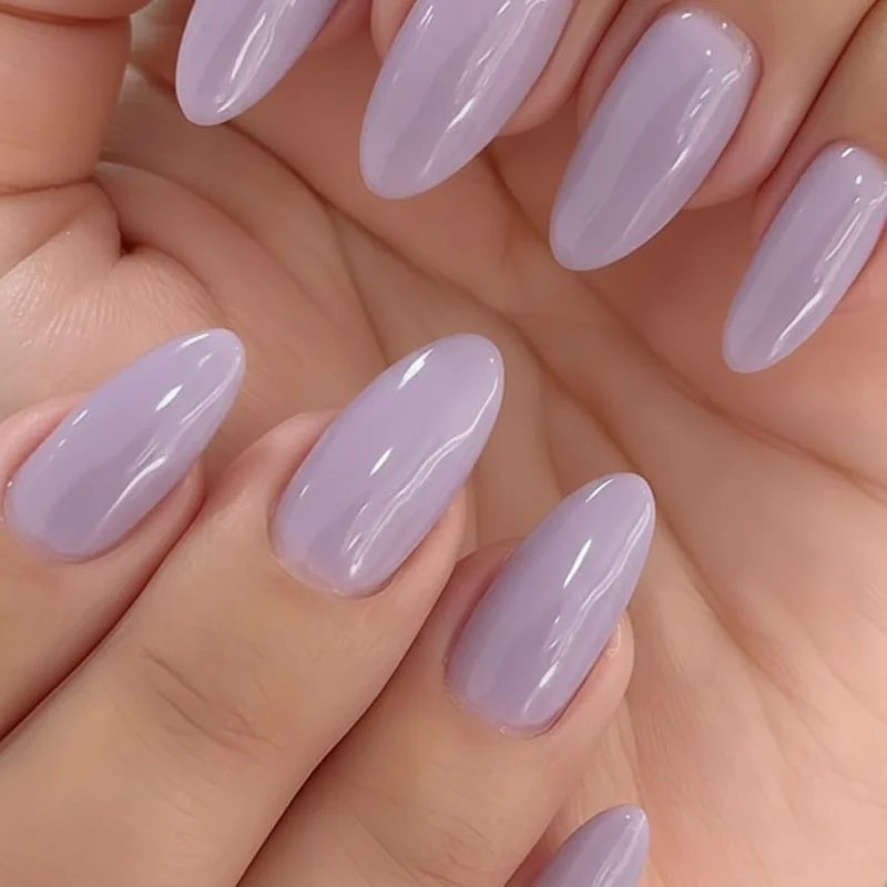 Lavender nail polish skin tone guide showing four undertone comparisons from cool blue lavender to warm lilac and smoky lavender on different hands