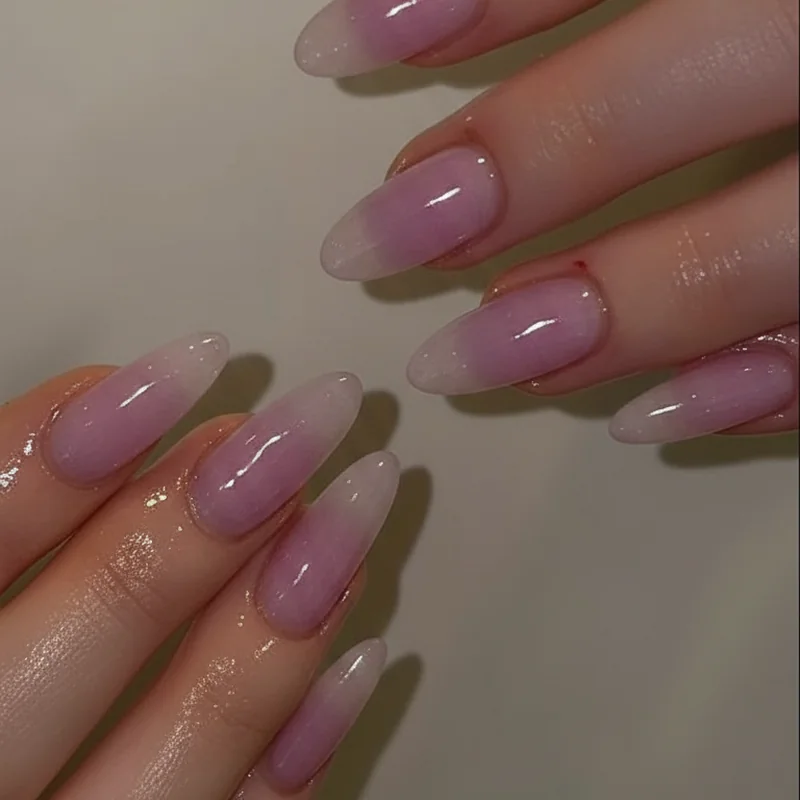 Lavender nails on short squoval nails showing jelly finish with soft purple colour and rounded edge shape for summer manicure