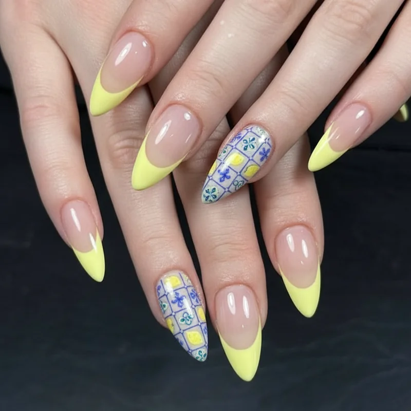 Lemon French tip nails with yellow tips and blue tile detailing on oval nails for wearable work ready summer manicure 2026