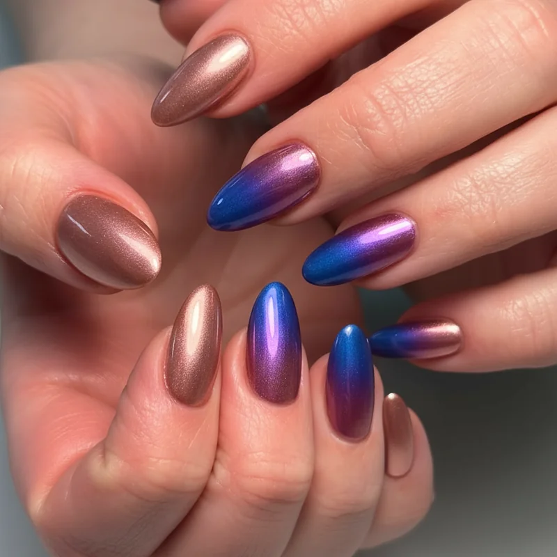 Chrome bi flag ombre nails with rose gold violet and cobalt mirror chrome powder gradient over gel base for bold bisexual pride statement manicure