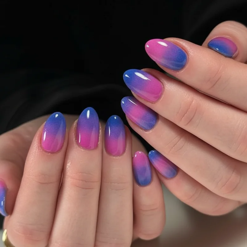 Bisexual ombre almond nails in pink purple and blue with sponge gradient blending nail art technique for bi pride June 2026